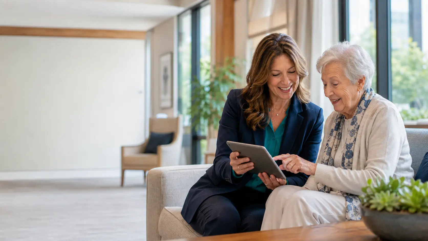 Care administrator helping an older resident complete a digital survey